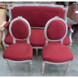 A French silvered wood three piece salon suite comprising a canape and a pair of side chairs.