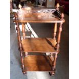 A Victorian walnut three tier whatnot