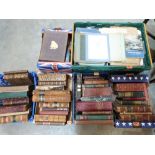 Five boxes of leather bindings and other books and a box of auction catalogues etc.