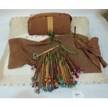 A lacemaker's work cushion with a collection of 32 treen bobbins