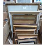 A box of framed pictures