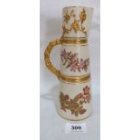 A Royal Worcester conical jug, no. 1047, painted in coloured enamels with flowers and enriched