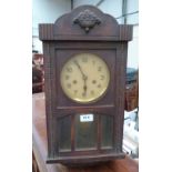 A small 1930s oak wall clock with two train movement