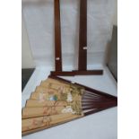 Two draughtsman's set squares and a large oriental fan