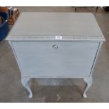 A fall front painted cabinet on cabriole legs