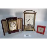 Two Swiss Looping alarm clocks, one leather cased and a German Schatz brass clock 5' high