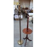 A mahogany lamp standard and a brass three light lamp standard