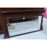 An early 20th century mahogany overmantle with bevelled plate. 46' wide