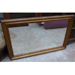 A gilt framed wall mirror. 42' x 27'