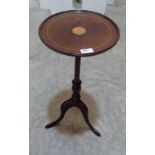 A mahogany and inlaid wine table on tripod support