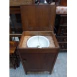 An oak cabinet with inset sink