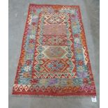 A wool Choli Kilim rug 1.55m x 0.95m