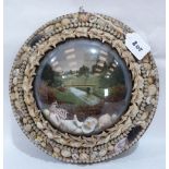 An Edwardian shell-work souvenir diorama, with lithograph in colours depicting an urban park,