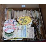 A box of vintage beer mats