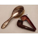 A silver hairbrush and a cased tobacco pipe and silver collar