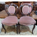 A pair of Victorian rosewood salon chairs on French cabriole legs