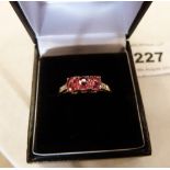 A red tourmaline and diamond ring. In gold marked 375. 1.8g gross. Size S