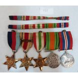 A World War II medal group: The Defence Medal; the Service Medal, The Italy Star; The Africa Star