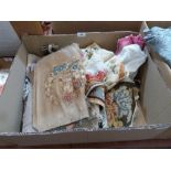 A box of needlework textiles