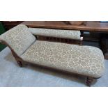 A Victorian walnut chaise-longue