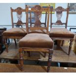 A set of four Edwardian walnut dining chairs