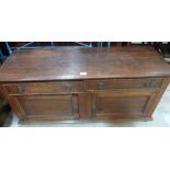 An oak low cabinet with two frieze drawers over two cupboard doors. 48' wide