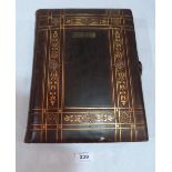 A Victorian leather bound album of photographs
