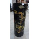 A Japanese black lacquer pedestal painted with two dragons and a flaming pearl. 36' high