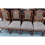 A set of four late Victorian oak dining chairs