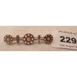 A Victorian 15ct bar brooch, the knife wires with coral, diamonds and split pearls in five settings.
