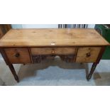 A 19th century pine sideboard on ring turned legs. 54' wide