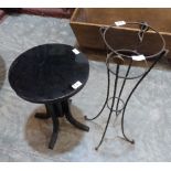 A Deco style black lacquered stool and a wrought metal plant