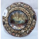 An Edwardian shell-work souvenir diorama with a marine lithograph in colours, mounted with shells