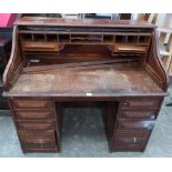 An oak roll-top desk. 50' wide (A.F.)