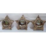 A group of three Edwardian shell-work souvenir dioramas, of star form, each with a lithograph in