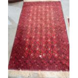 A Caucasian red ground rug. 80' x 48'