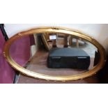 A gilt framed wall mirror