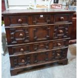 A Jacobean oak chest, in two parts, with four geometrically moulded long drawers, raised on