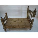 An early 20th century miniature gilt brass bedstead. 15' long (A.F.)