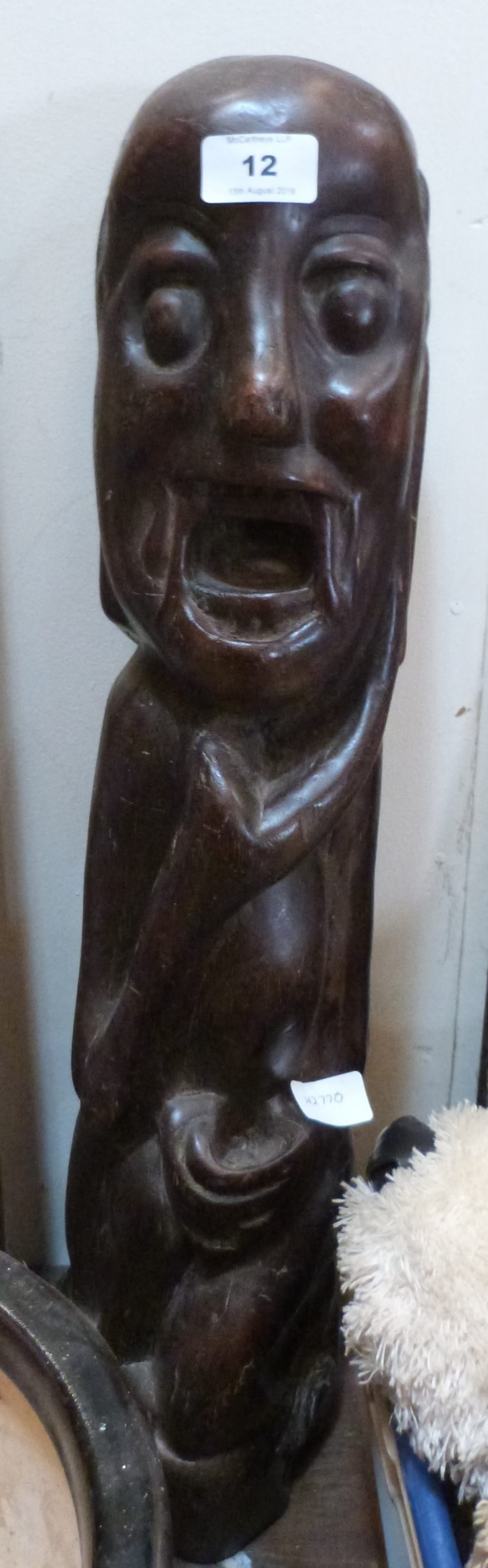 An ethnic carved hardwood figure. 24' high