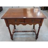 An oak side table with a pair of frieze drawers on turned legs. Of recent manufacture, 33' wide