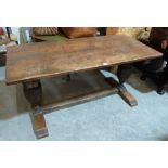 A 19th century Jacobean style oak refectory table, the two plank top raised on cup and cover bulbous