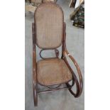 A continental bentwood rocking chair with caned back and seat