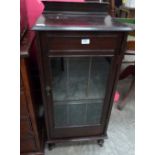 A mahogany glazed record cabinet