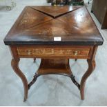 An Edward VII rosewood and foliate inlaid envelope card table