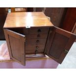 A Victorian oak specimen chest, the two short over four long drawers enclosed by a pair of panel