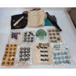 A collection of French vintage buttons, various textiles and two fans