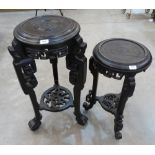 Two Oriental ebonised pot stands, the taller 32' high