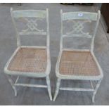 A pair of 19th century painted side chairs with caned seats