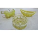 A Victorian pressed vaseline glass perambulator 4½' long, a navette bowl and a circular bowl